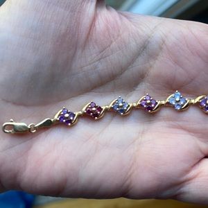 14 K gold tanzanite, amethyst, and rose bracelet.